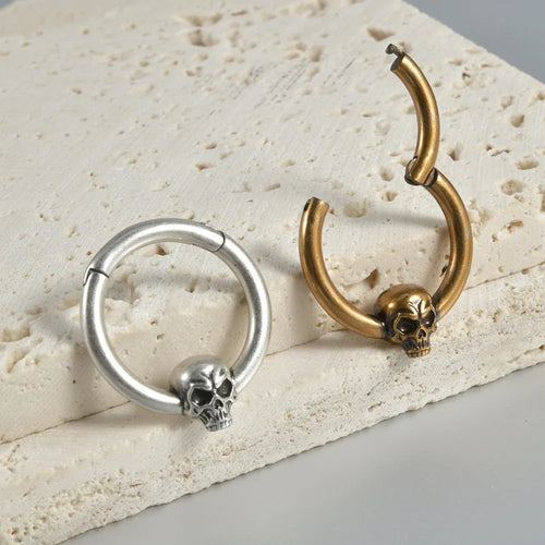 Copper ghost head earrings in antique gold or silver finish, single or triple design.