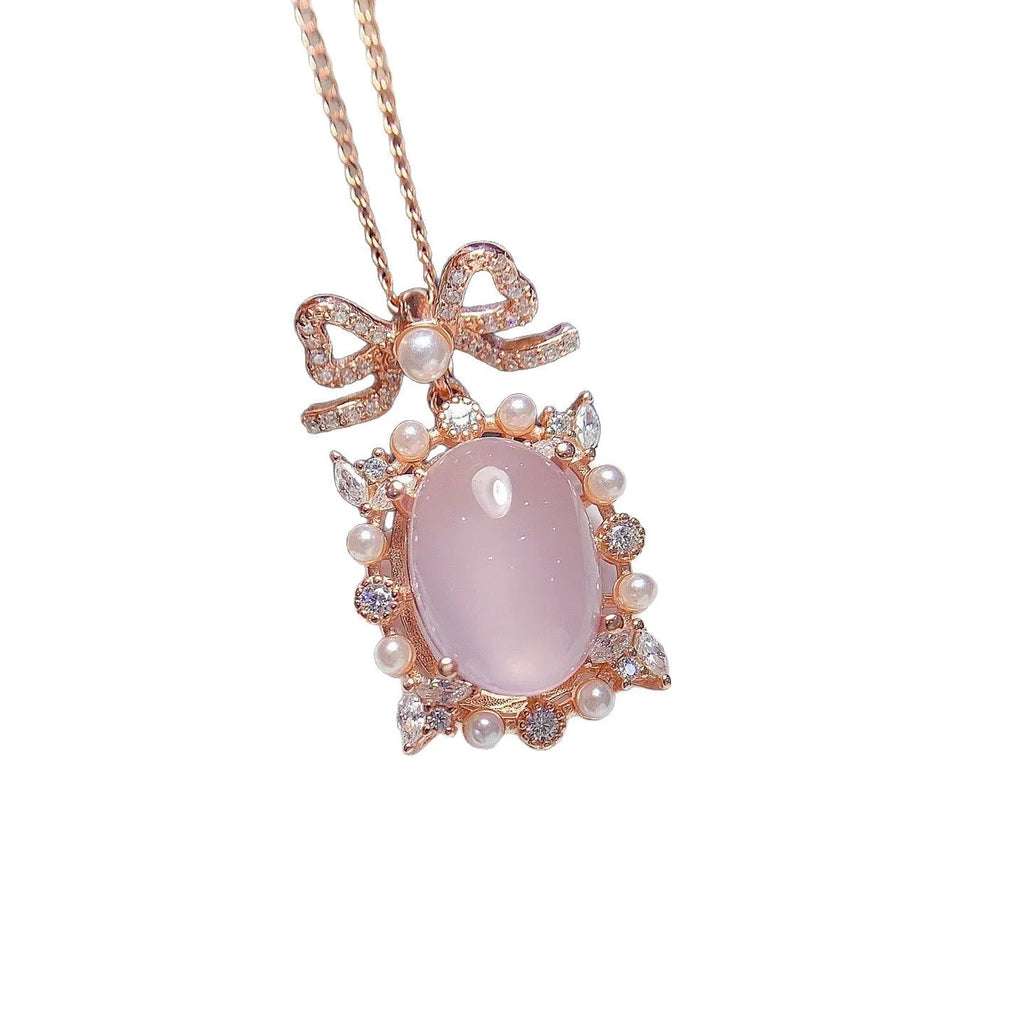Geometric rose quartz pendant on a silver chain with rose gold plating