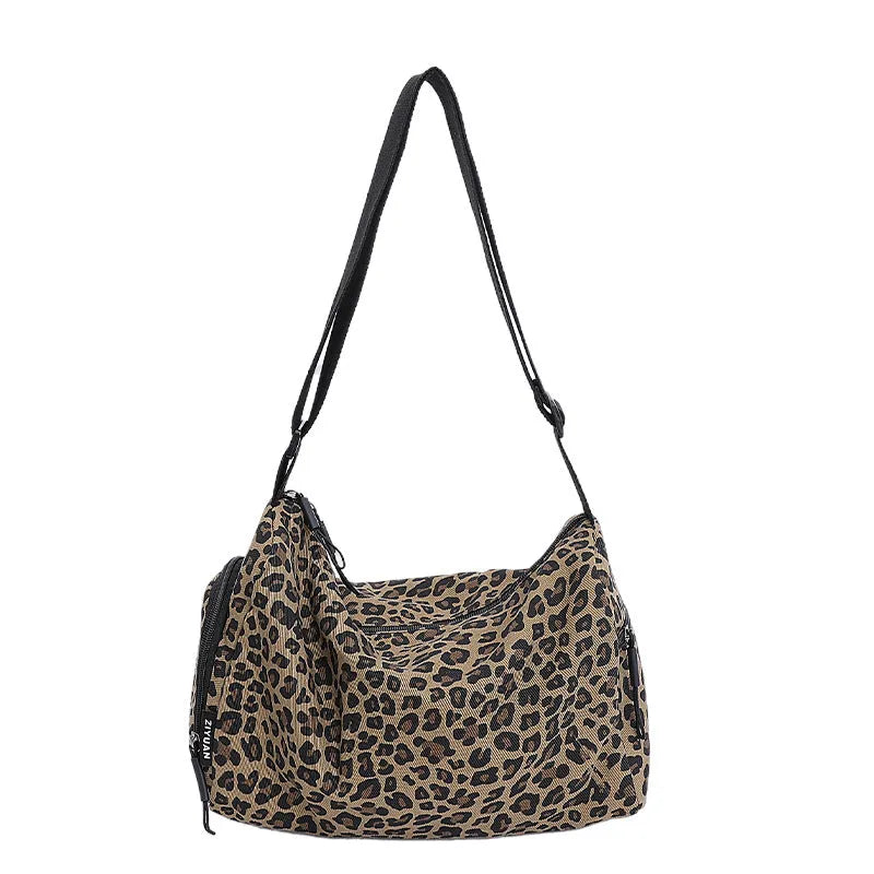 Leopard print sports style cross-body messenger bag with large capacity and durable stitching