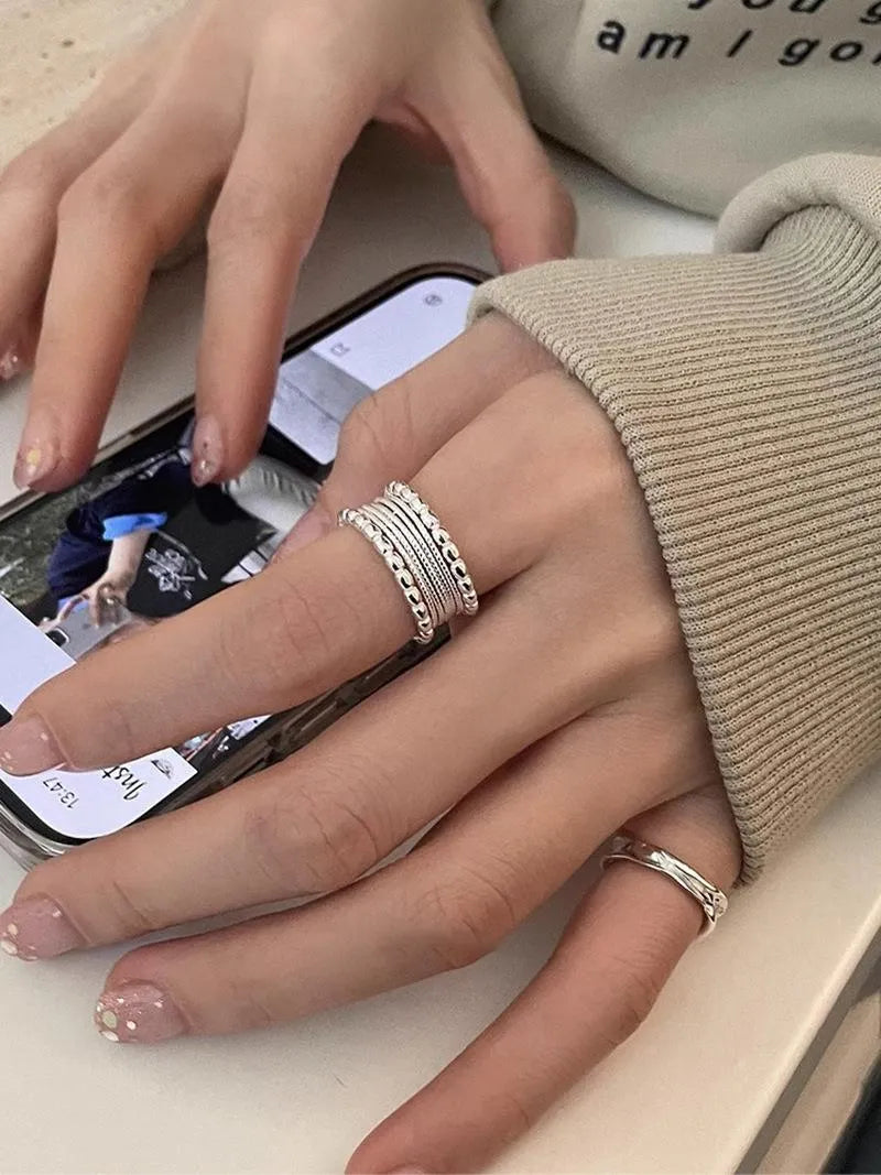 Copper alloy geometric ring with woven twisted multilayer design and adjustable opening