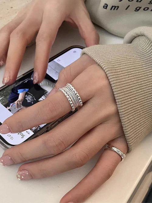 Copper alloy geometric ring with woven twisted multilayer design and adjustable opening