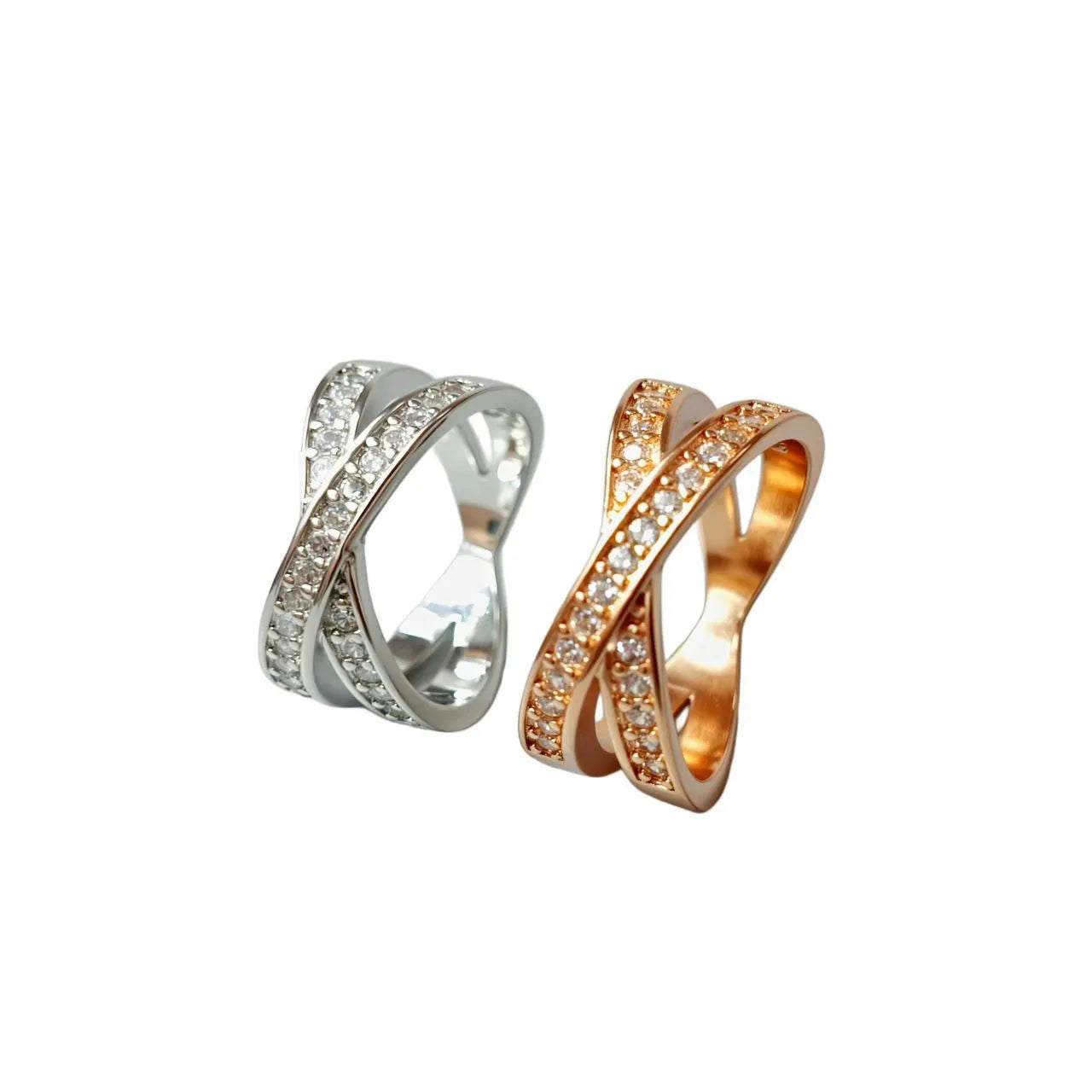 A simple copper ring with a metal cross design featuring micro-inlaid zircon, shown in rose gold and silver tone finishes.