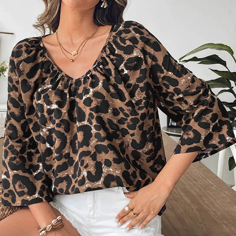Women's leopard print V-neck pullover top with half sleeves and pleating details