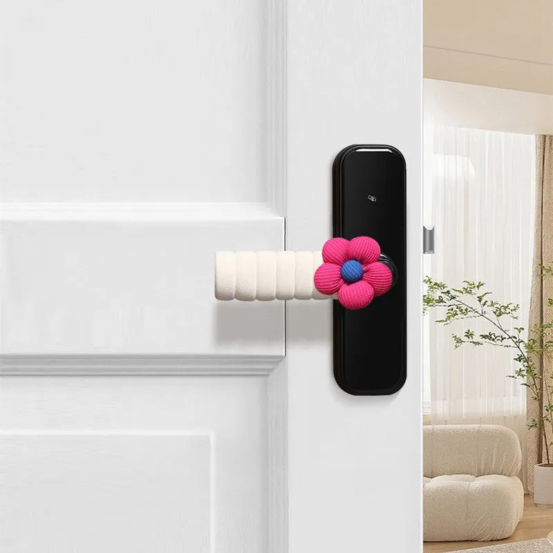 Flower pattern soft PEVA door handle protective cover on a round door knob.