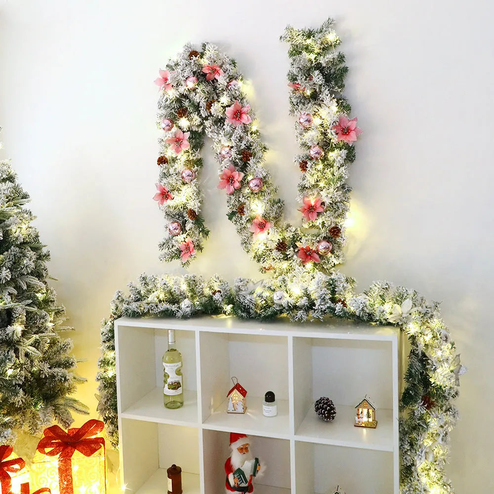 PVC Christmas rattan garland with flocked finish in golden colour option draped over mantelpiece