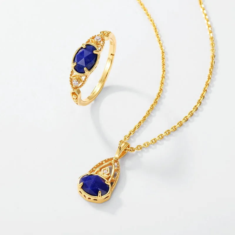 Japanese style silver alloy ring with blue elliptical lapis lazuli stone and geometric design.