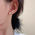 Women's copper fishtail design earrings in white gold or yellow gold colour.