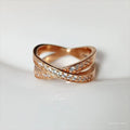 A simple copper ring with a metal cross design featuring micro-inlaid zircon, shown in rose gold and silver tone finishes.