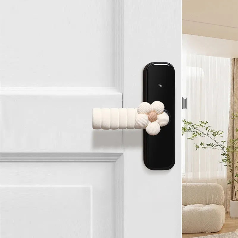Flower pattern soft PEVA door handle protective cover on a round door knob.