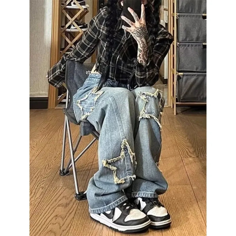 Blue high-waist straight-leg women's denim trousers on a hanger.