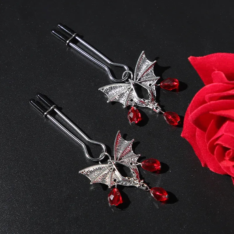 Silver alloy diamond bat nipple clamp with adjustable tension and ruby bat clip design