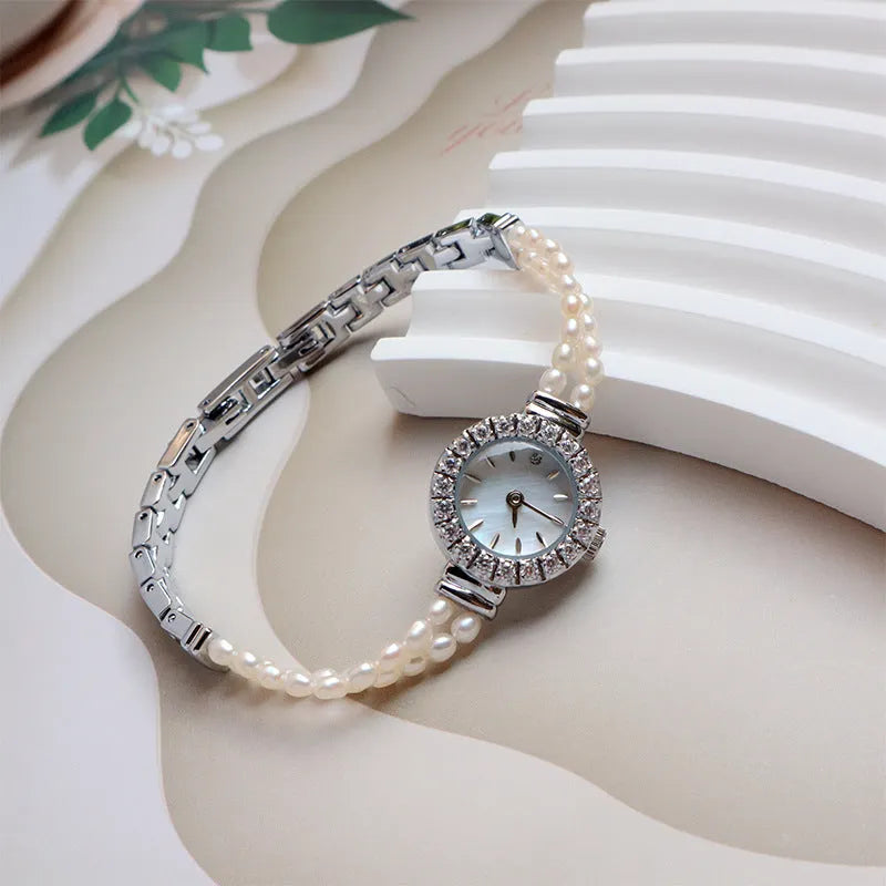 Women's light gold bracelet watch with freshwater pearls, round 18mm dial, stainless steel strap