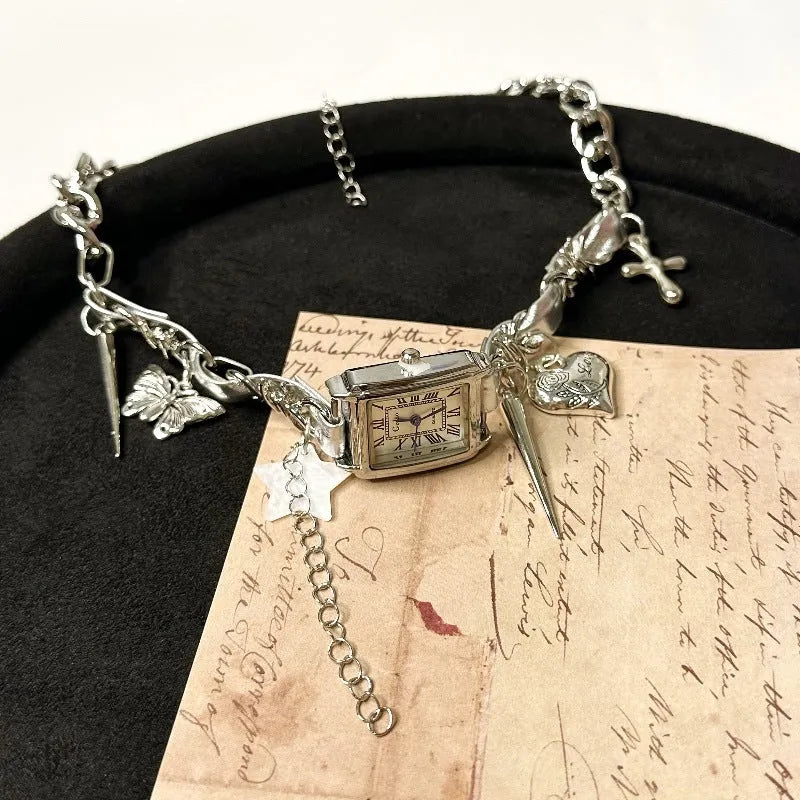 Dark multi-layer cross necklace with twin clavicle chains on model