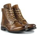Black and brown two-tone leather ankle boots with side zipper and low heel.