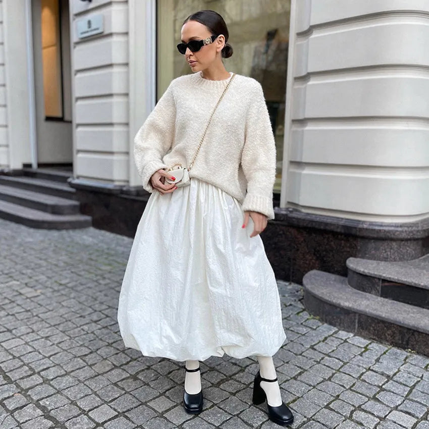 Women's solid colour cotton long skirt on a hanger, available in black or white.