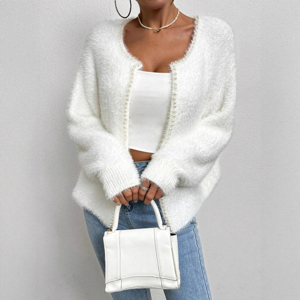 White women's V-neck cardigan sweater made from polyester knit fabric