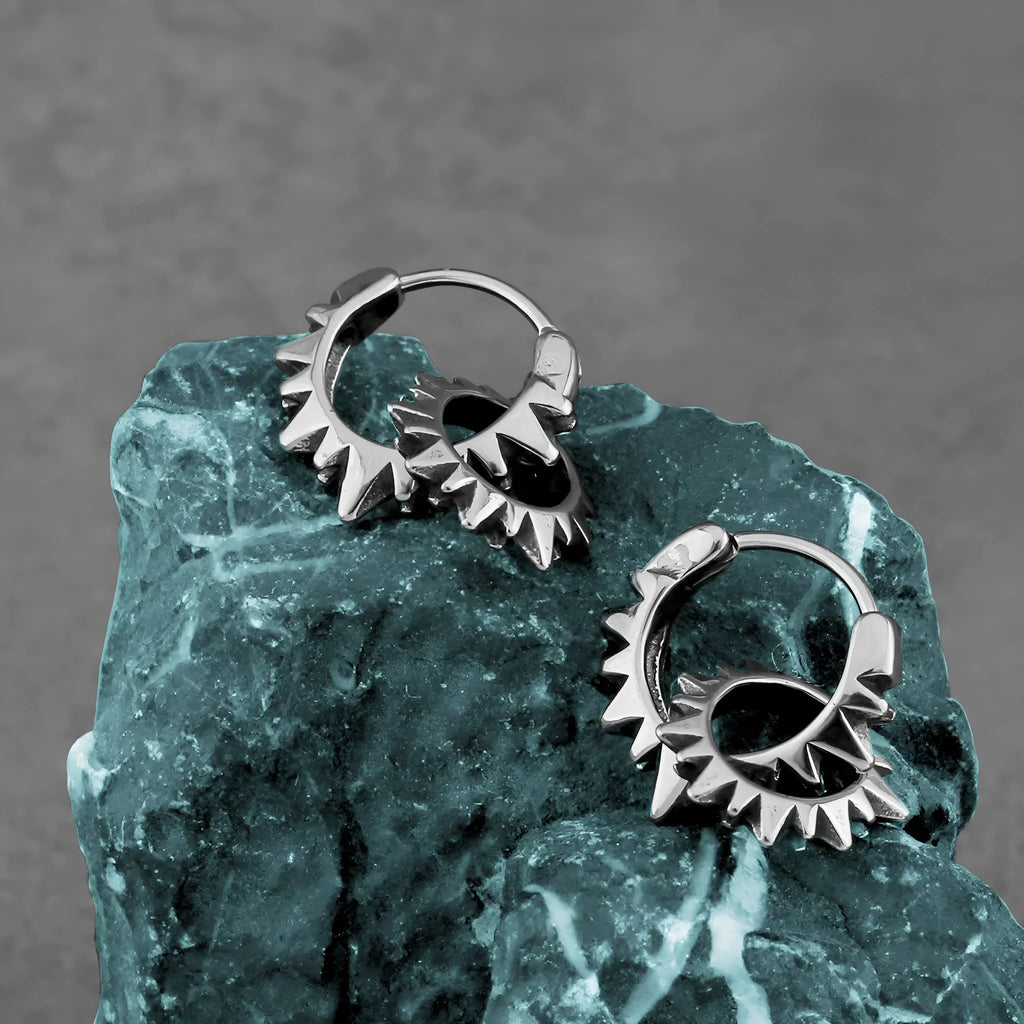 Polished stainless steel round hoop earrings in a steel colour with a simple retro design.