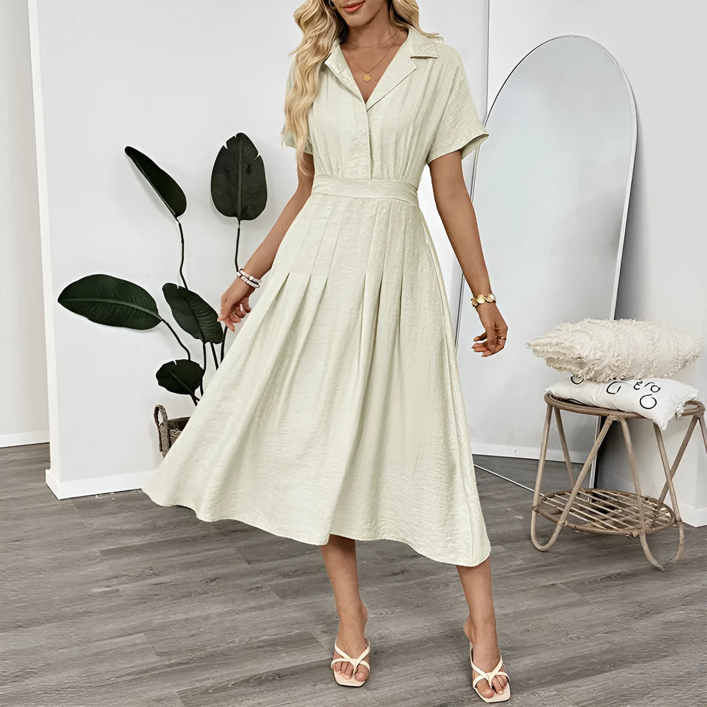 Light green lapel shirt dress with waist-tight skirt and pocket for office wear.