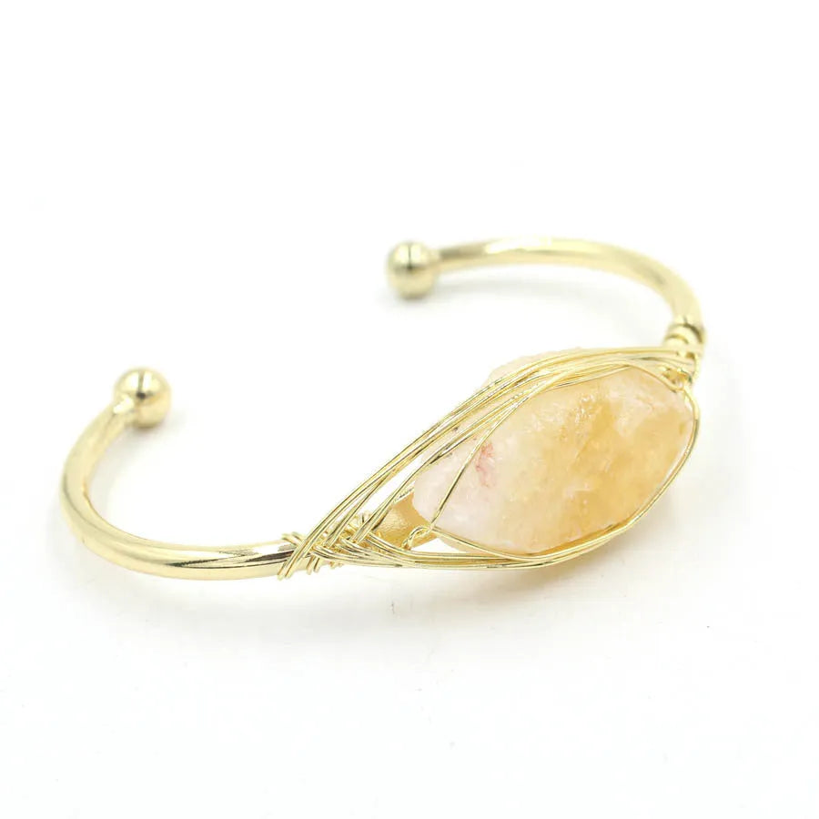 Natural raw gemstone bracelet with amorphous 8mm beads and a simple metal opening clasp.