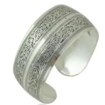 Ethnic carved open Miao silver bracelet showing turtle and elephant motifs