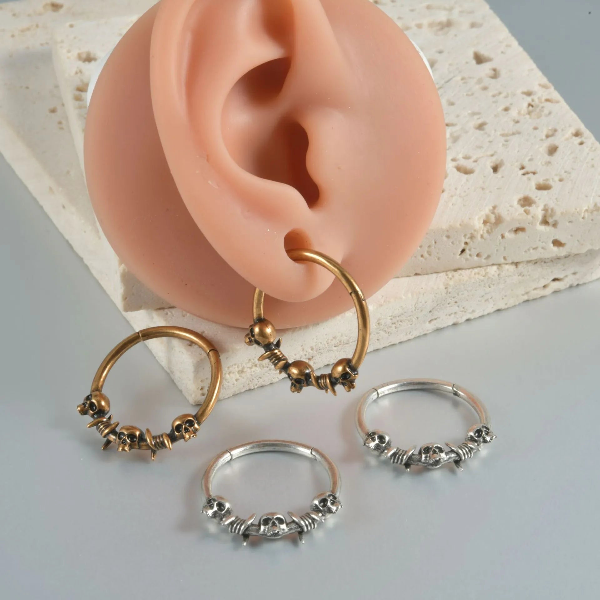 Copper ghost head earrings in antique gold or silver finish, single or triple design.