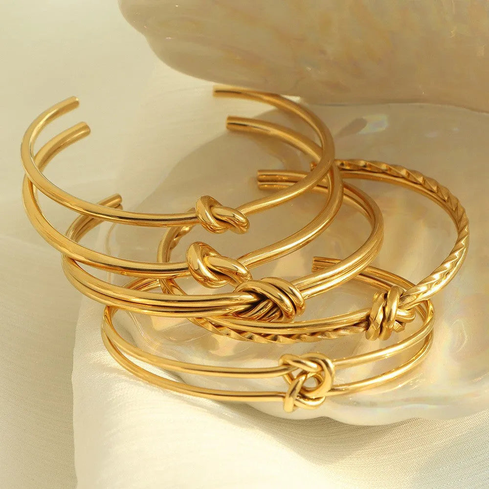 Gold plated stainless steel knotted C-shaped open double-layer adjustable women's bracelet.