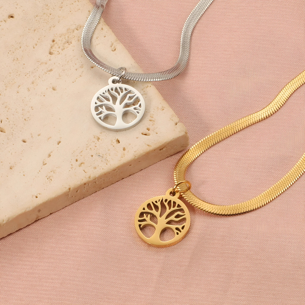 Stainless steel necklace with tree pendant on a snake bone chain in gold or steel colour.