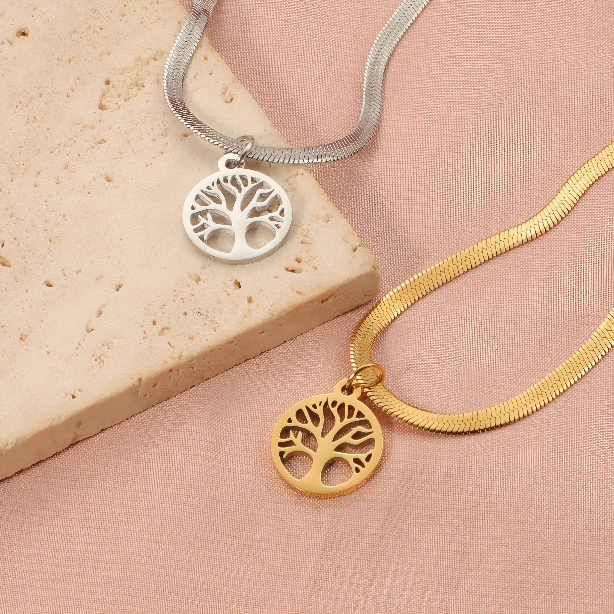 Stainless steel necklace with tree pendant on a snake bone chain in gold or steel colour.