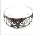 Ethnic carved open Miao silver bracelet showing turtle and elephant motifs