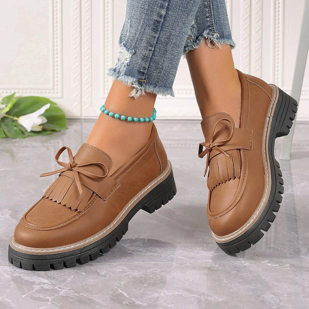 Women's black plus size loafers with tassel decoration, chunky heel, and round toe design
