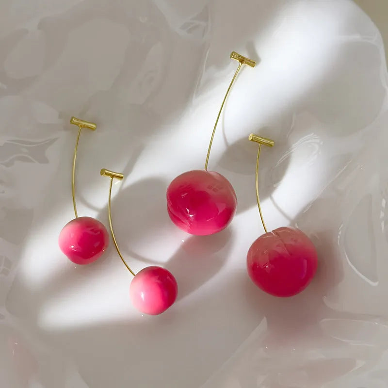 Acrylic peach fruit earrings in small and large size variations with copper findings