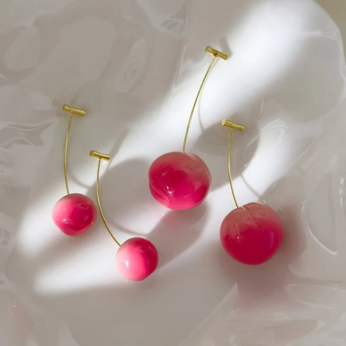 Acrylic peach fruit earrings in small and large size variations with copper findings