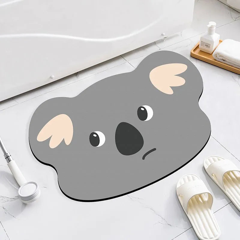 Cute animal cartoon design diatom oil absorbent non-slip bathroom mat on tiled floor.