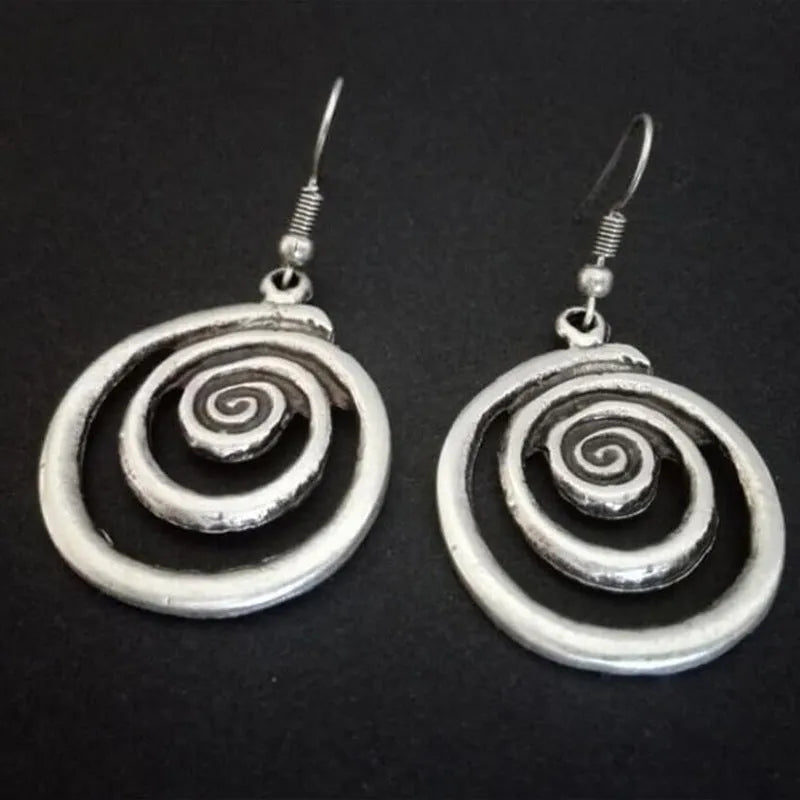 Retro geometric spiral earrings with distressed silver finish measuring 2.6 by 5 centimetres