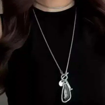 Women's long sweater chain necklace with geometric plaid pattern pendant on snake bones chain