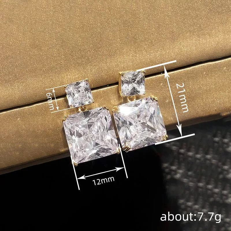 A pair of geometric square-shaped copper earrings for women, shown in gold and white gold colour options.