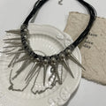 Women's casual leather necklace with winding round beads, tassel pendant, and silver rivet details