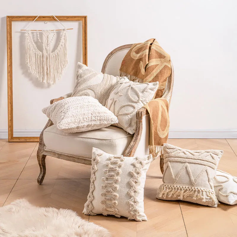 Knitted striped cushion cover with tassel detail in spiral dots design, shown in 45x45cm size.