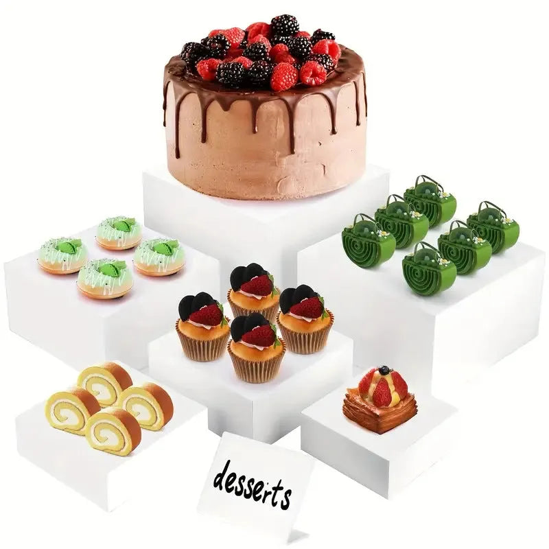 White plastic cube dessert display stand with six modular stacking components for cake presentation