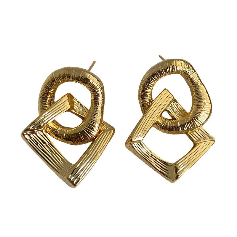 Retro geometric circle drop earrings in gold or silver colour with a 3.4cm copper pendant.