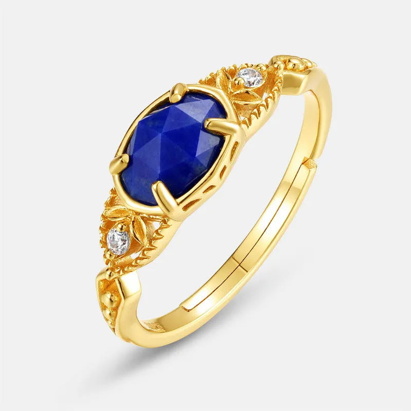 Japanese style silver alloy ring with blue elliptical lapis lazuli stone and geometric design.