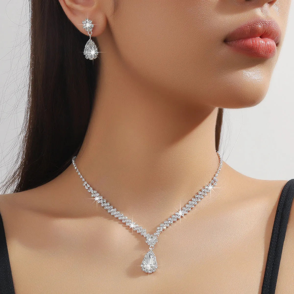 Claw chain necklace and earrings set with water drop rhinestone pendants in multiple colour options