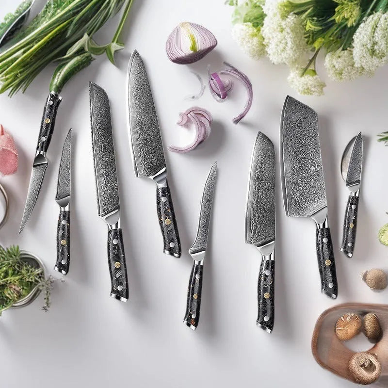 Damascus steel kitchen knife set showing eight different blade sizes with fishbone pattern detailing