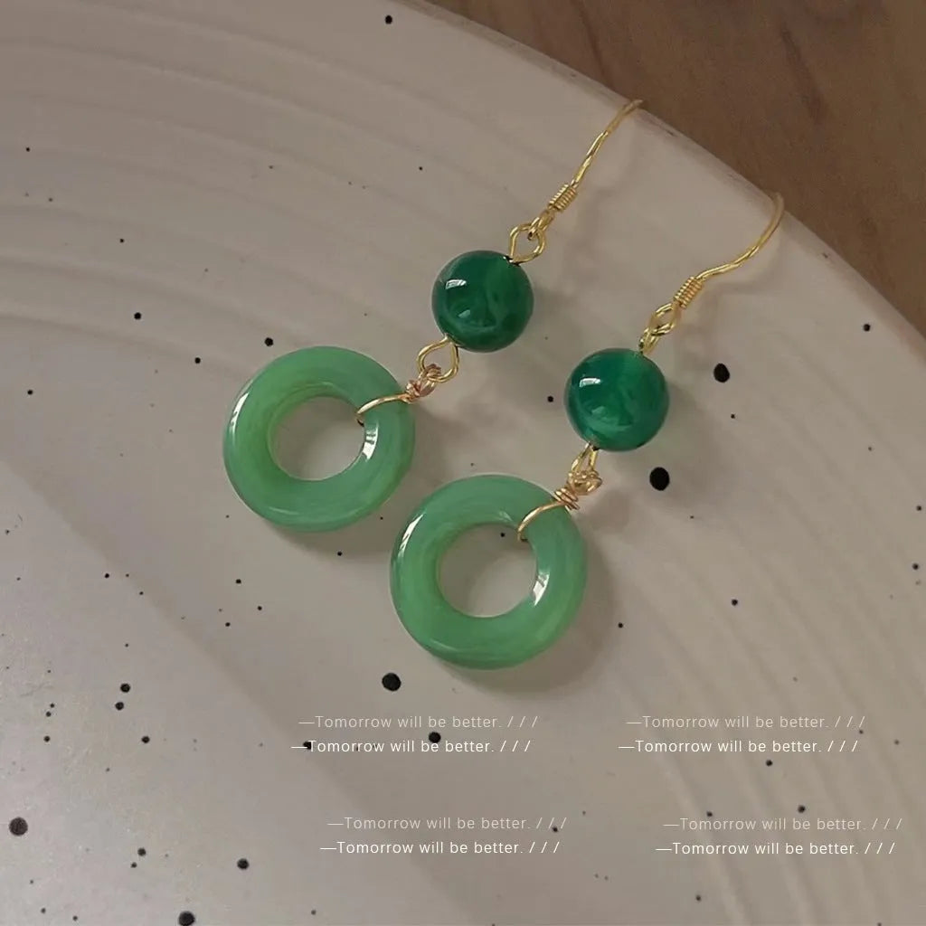 Green Chinese style peace buckle shape earrings with geometric ring design