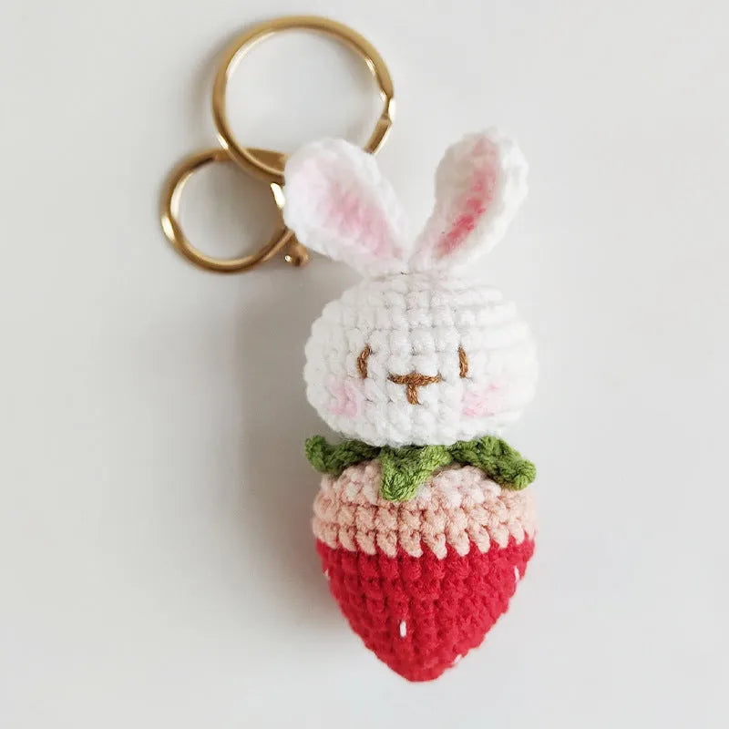 Hand-woven white wire pendant with rabbit strawberry cartoon design and key attachment