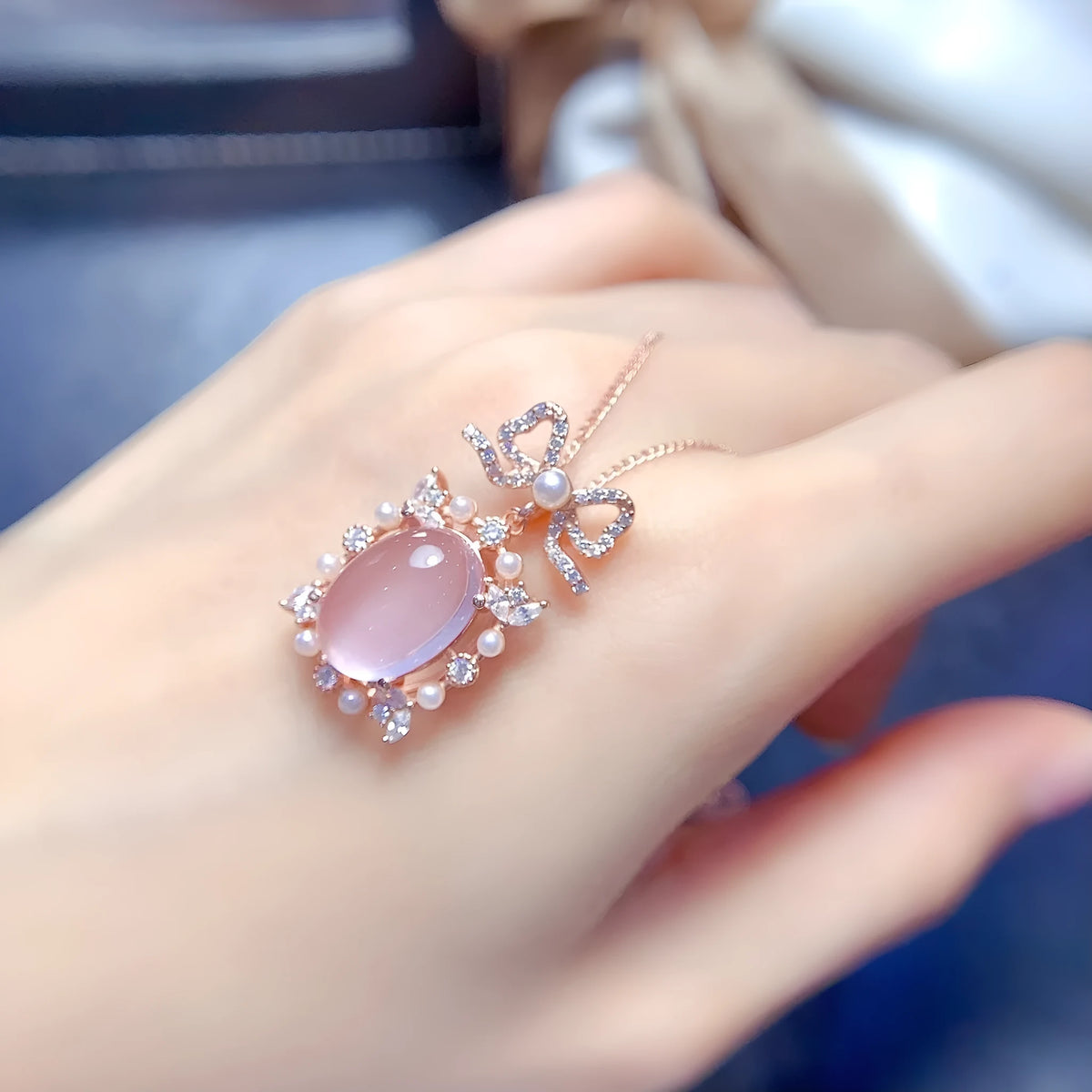 Geometric rose quartz pendant on a silver chain with rose gold plating