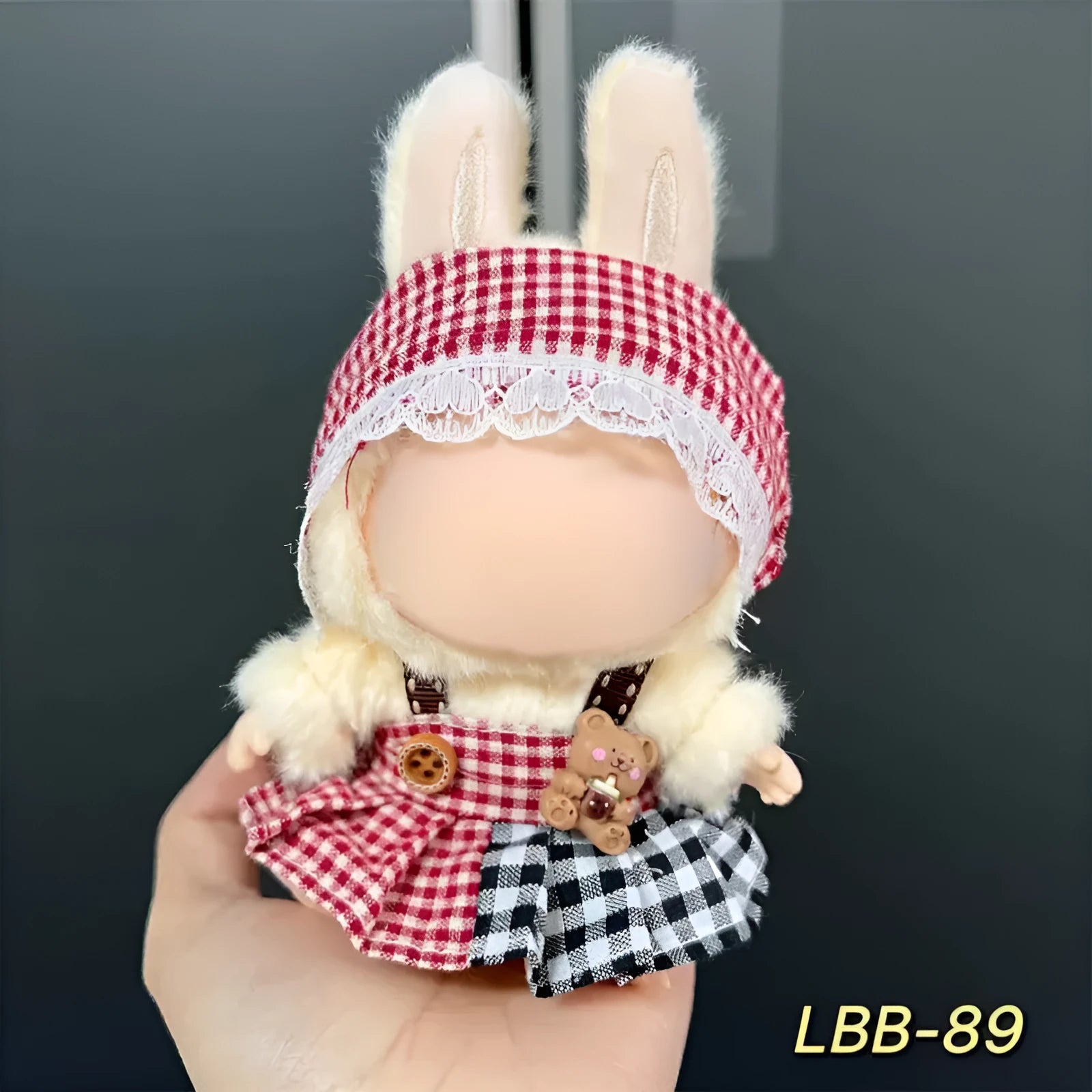 Plastic doll clothes costume for a 17cm vinyl action figure on a white background
