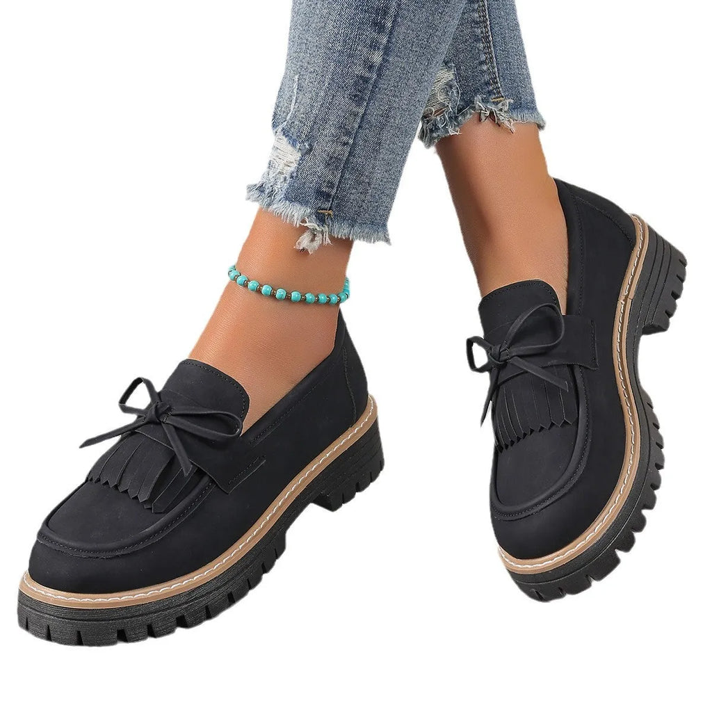 Women's black plus size loafers with tassel decoration, chunky heel, and round toe design