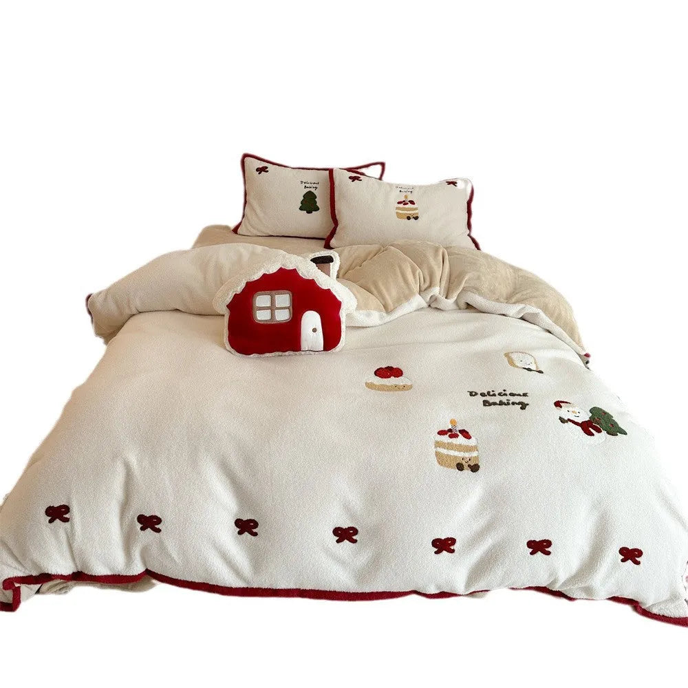 Winter Christmas cartoon pattern four-piece polyester bedding set showing heart design on duvet cover and pillowcases.