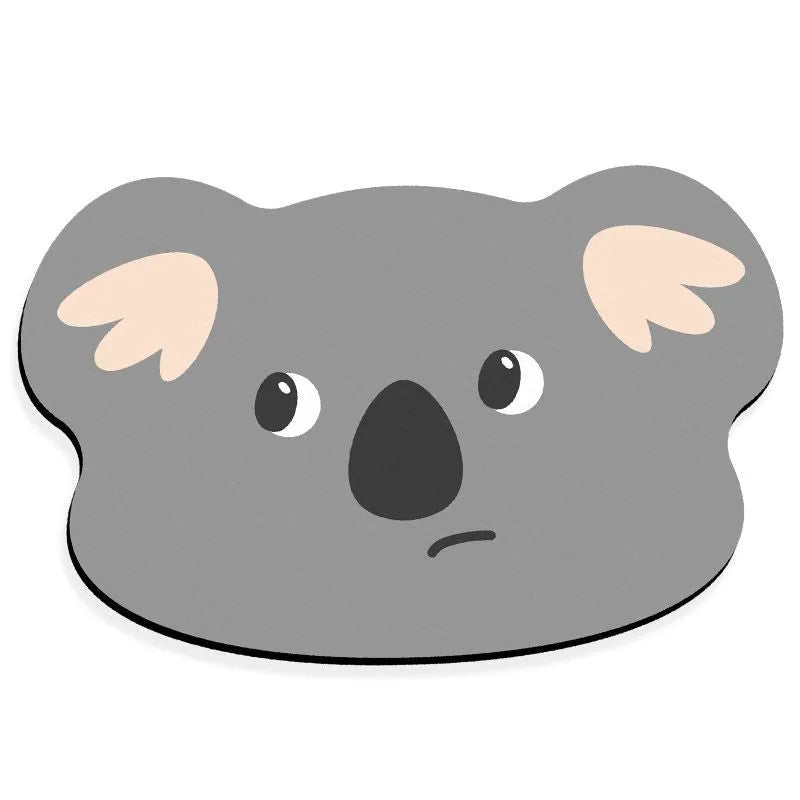 Cute animal cartoon design diatom oil absorbent non-slip bathroom mat on tiled floor.